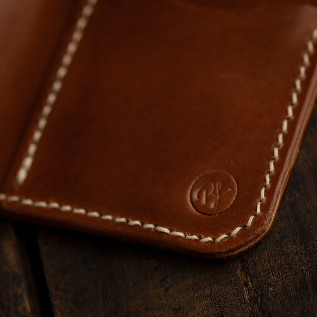handmade leather bifold wallet with provision leatherworks logo
