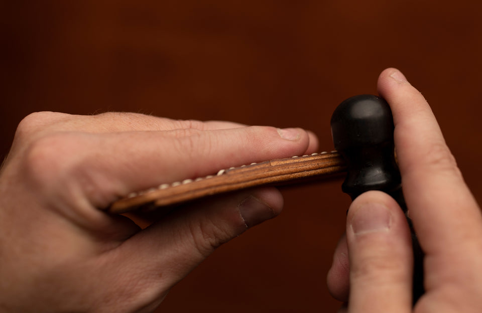 hand burnishing leather wallet edges