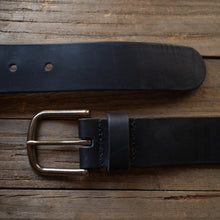 Load image into Gallery viewer, black leather belt on wood background
