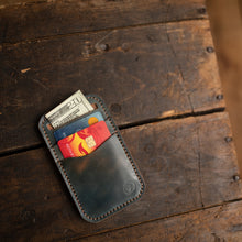 Load image into Gallery viewer, marbled blue shell cordovan leather minimalist wallet with cards and money in slots
